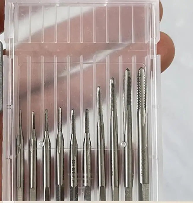 The taps in their slotted plastic case