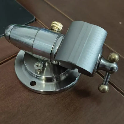 The vise held in a hand, showing the ball joint and locking lever