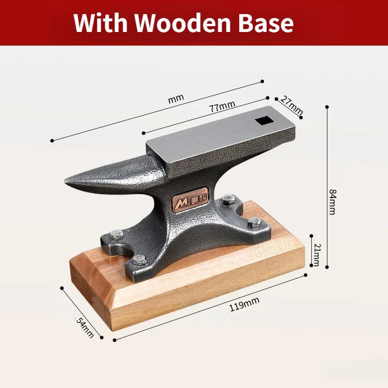 Anvil on its wooden base with dimensions: base 119 x 54 x 21 mm, 84 mm tall