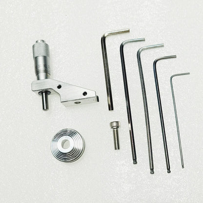 Micrometer head on its bracket with the cone pulley, screw and hex keys