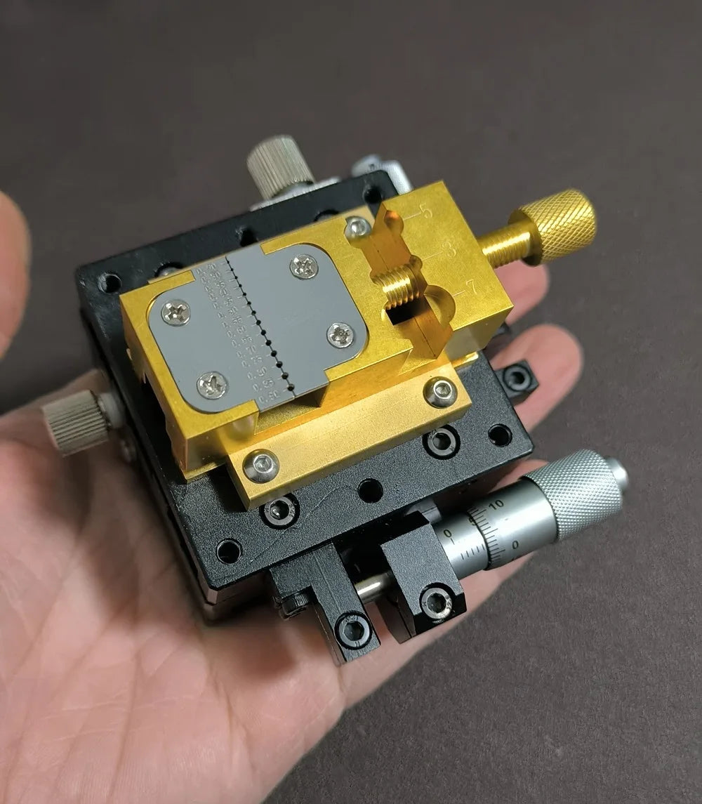 Brass jaws holding a watch plate