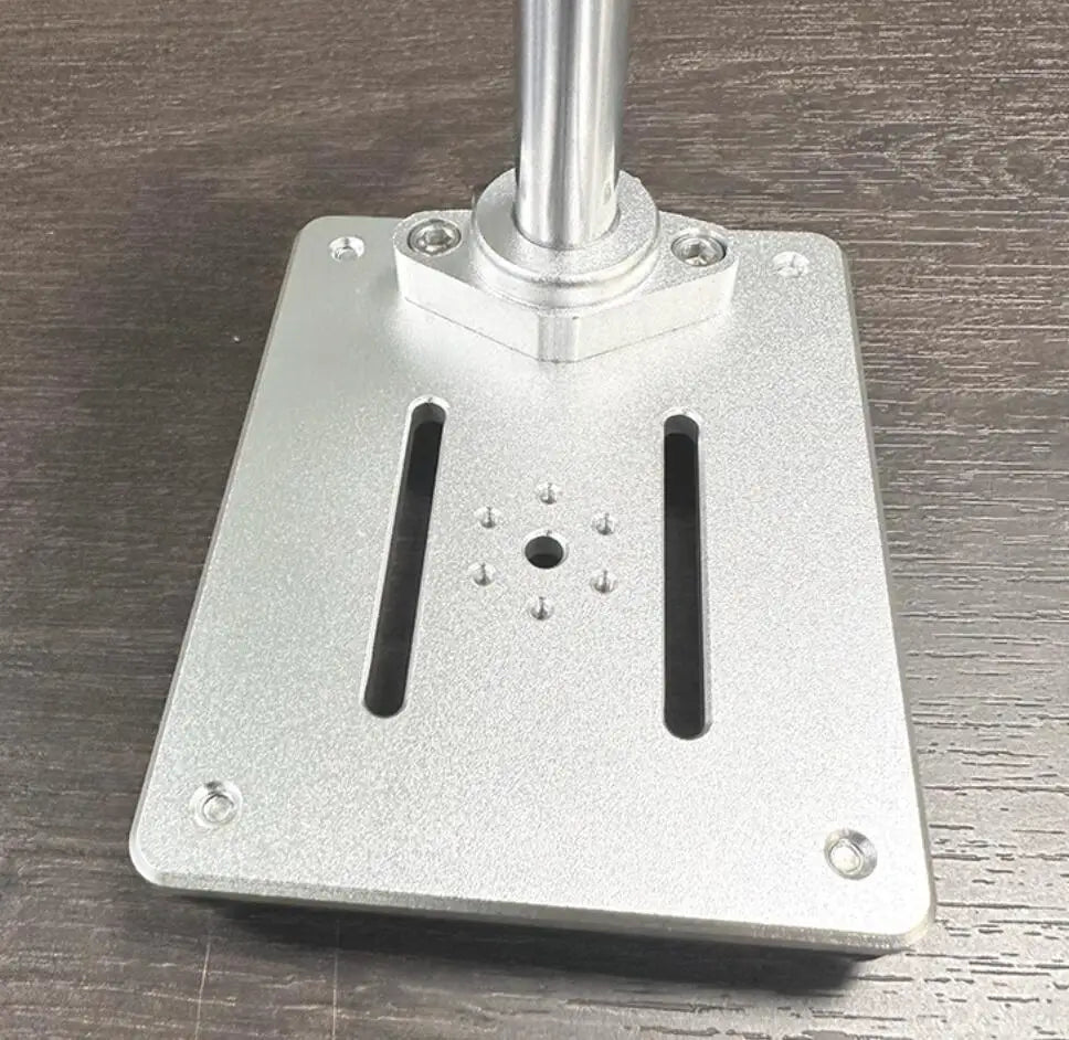 The base, two slots and a ring of holes around the centre