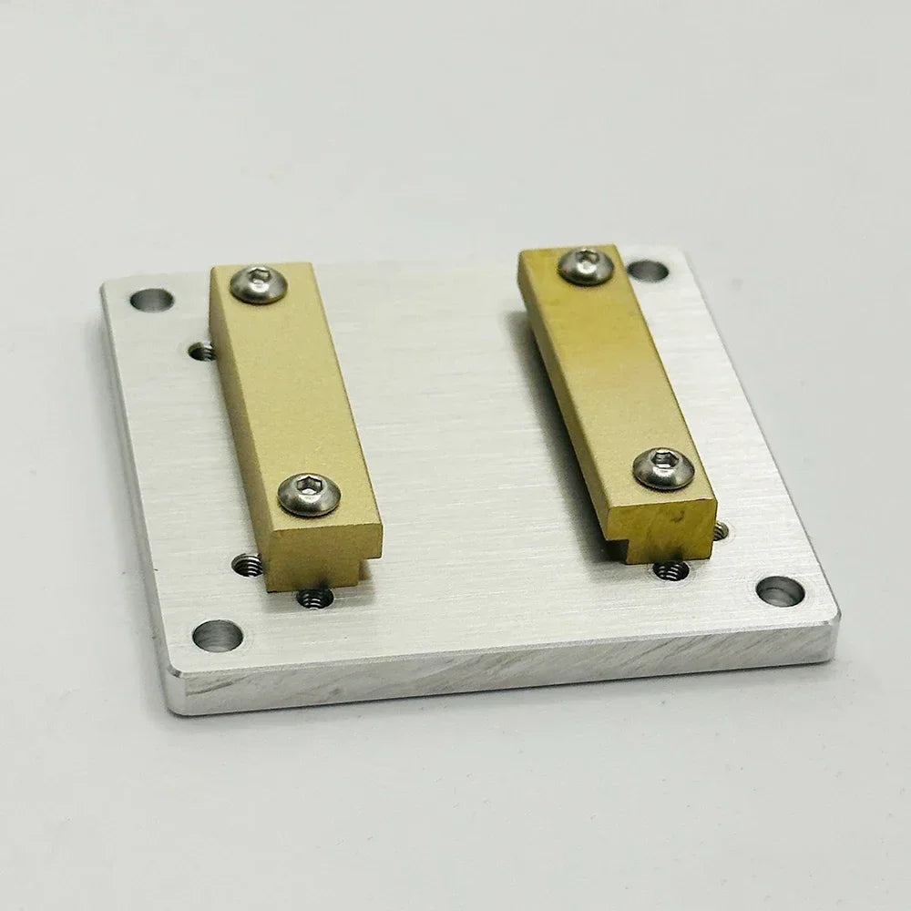The plate seen from above, showing the four countersunk corner holes