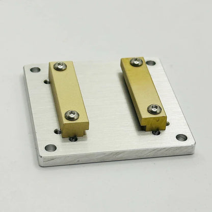 The plate seen from above, showing the four countersunk corner holes