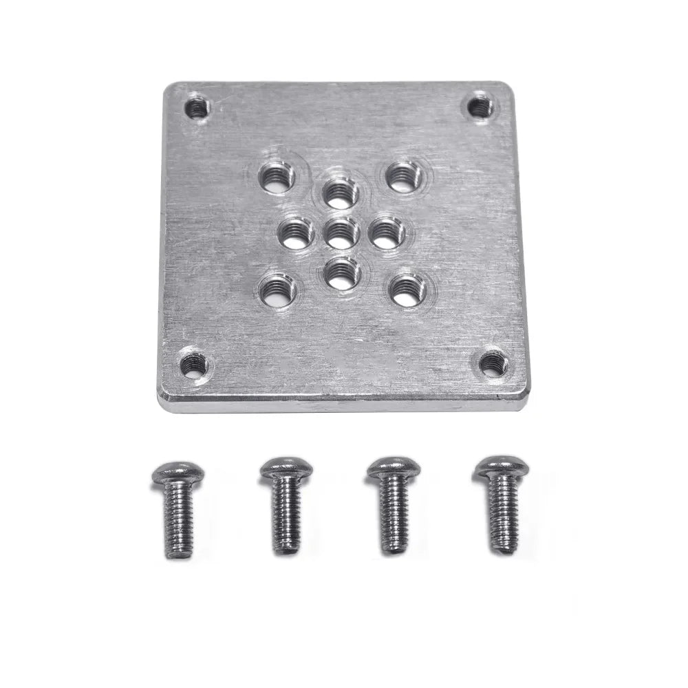 The plate from above with its four fixing screws