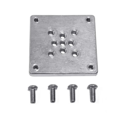The plate from above with its four fixing screws