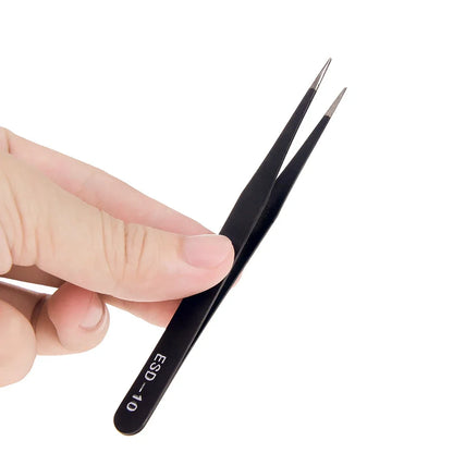 Tweezers handling a small component