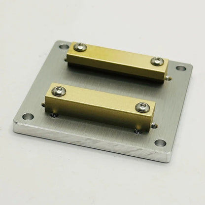The plate at a low angle, brass rails in the foreground