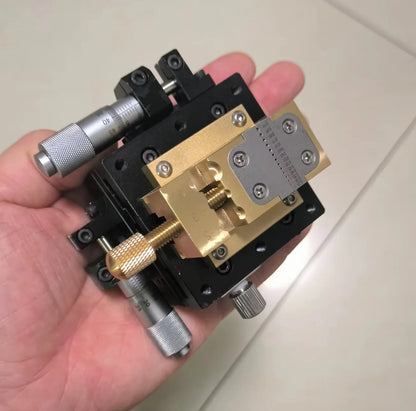 XY stage lead screws under the brass vise
