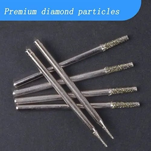 Diamond-tipped drill bits laid out in a row