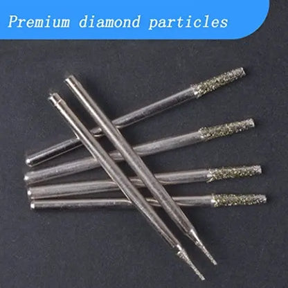 Diamond-tipped drill bits laid out in a row