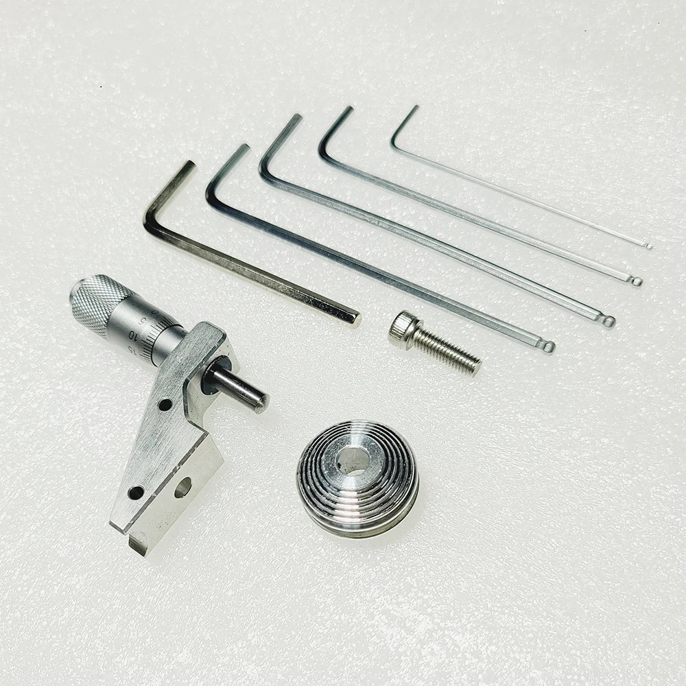 The full kit laid out, micrometer, pulley, screw and seven hex keys