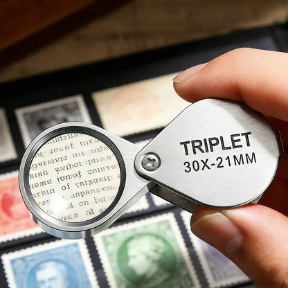 The loupe held in the hand over printed detail