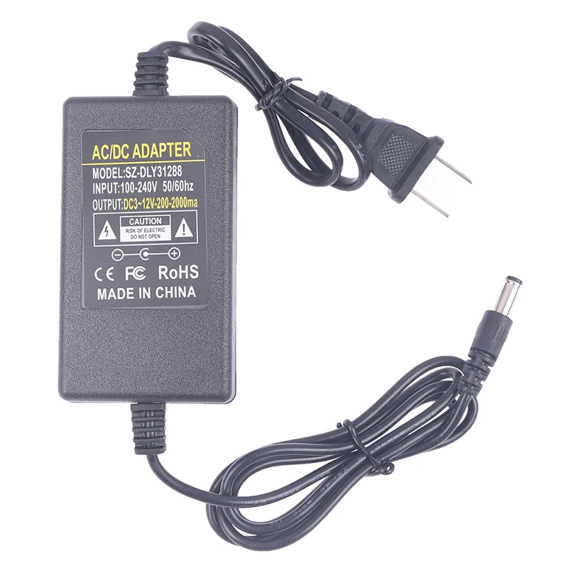 Maker's label: model SZ-DLY31288, input 100-240 V, output DC 3-12 V, 200 to 2000 mA, centre positive