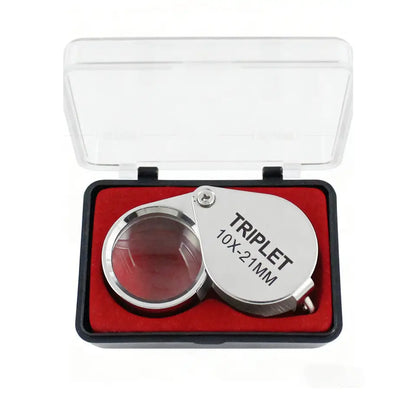The loupe in its hard case