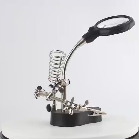 Helping hands with magnifier